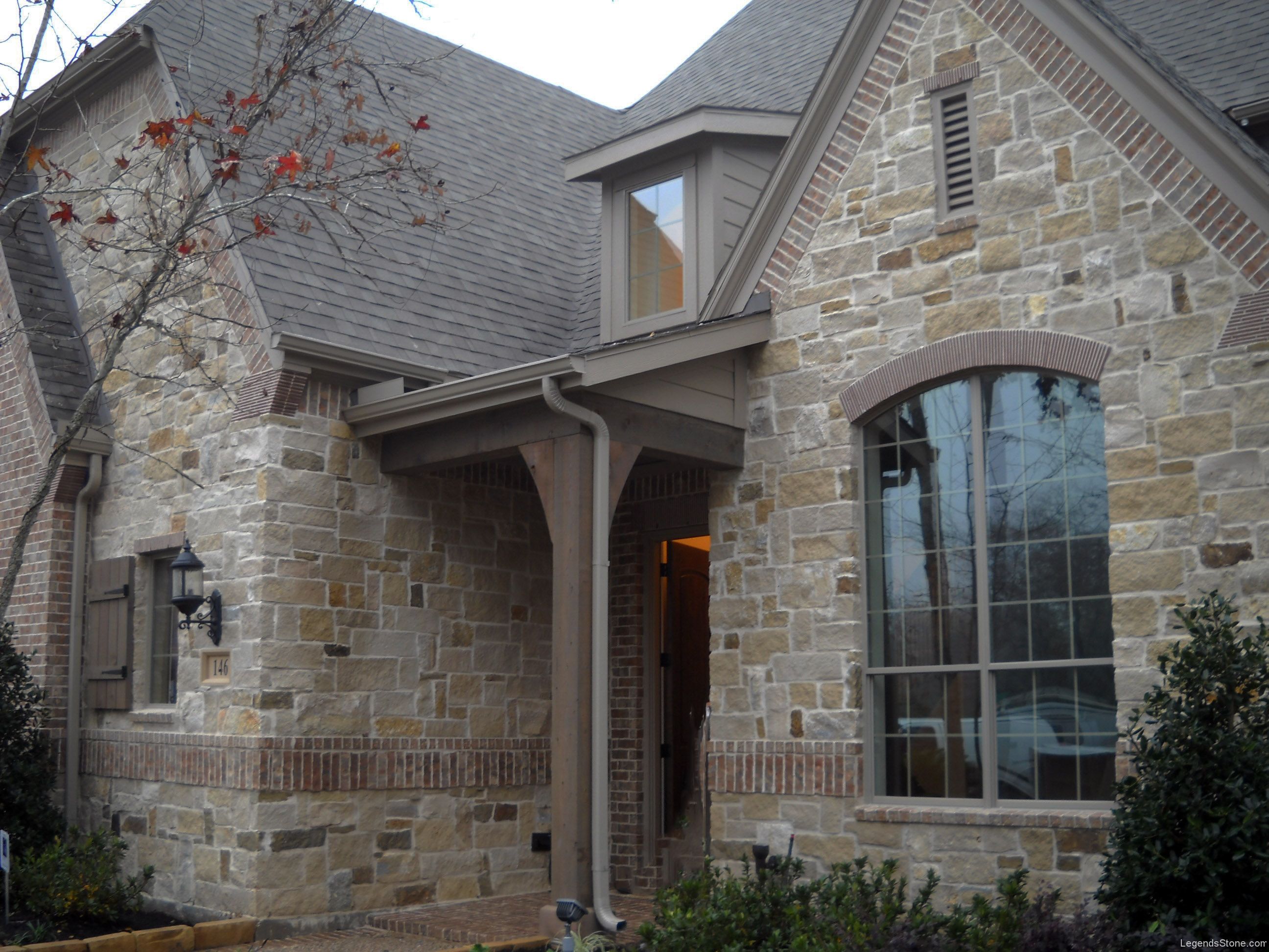 Modern French Country stone veneer exterior front porch home