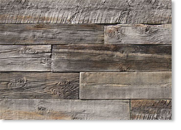Weathered gray wooden planks arranged in a horizontal pattern, showing grain and knots.