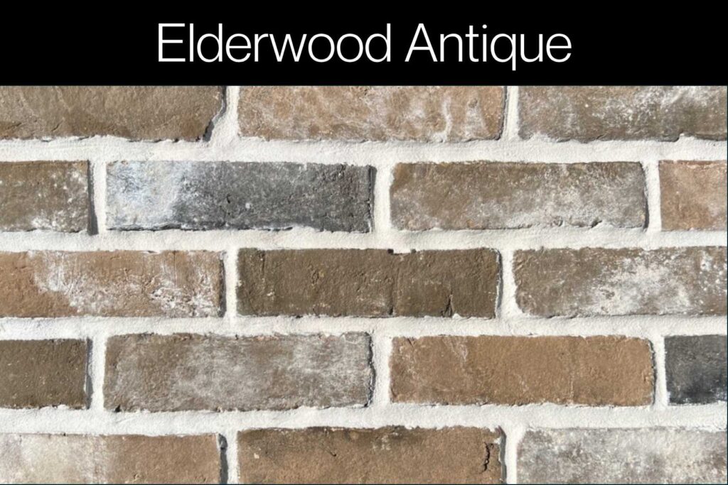Antique brick with deep charcoal and warm brown tones, lightly dusted with white for a natural, weathered finish.