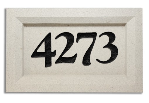 House number plaque displaying 4273 in bold black digits on beige background.