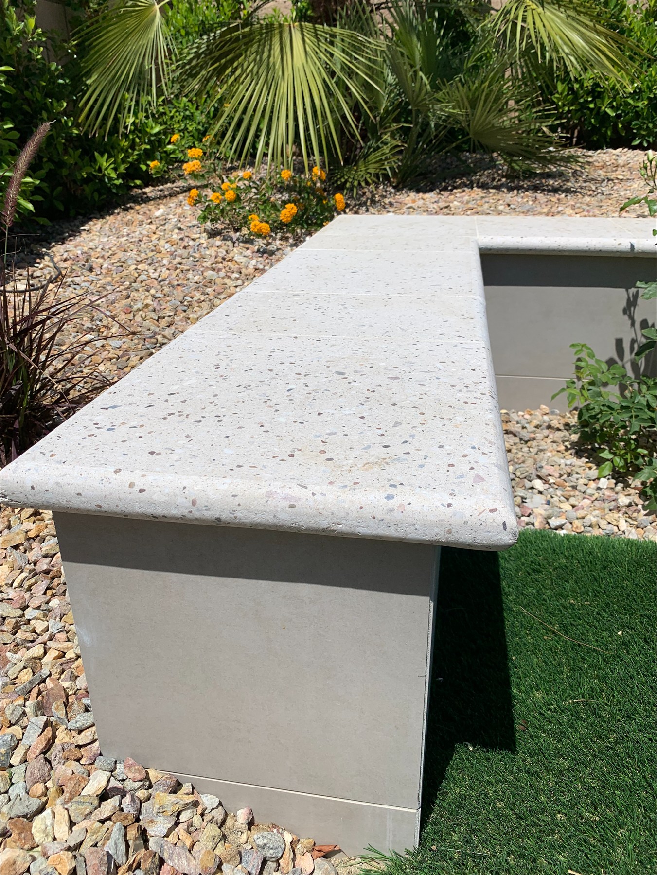 Artistic Pavers coping on a raised wall